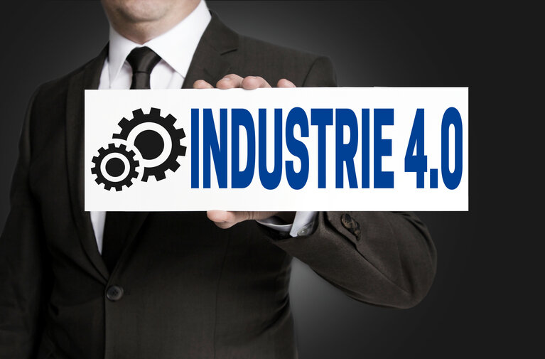 industrie 4.0 in german industry sign is held by businessman