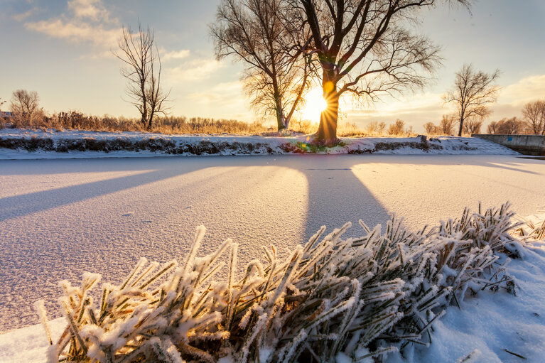 Dawn over the river in winter morning