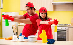 Cleaning professional contractors working at kitchen