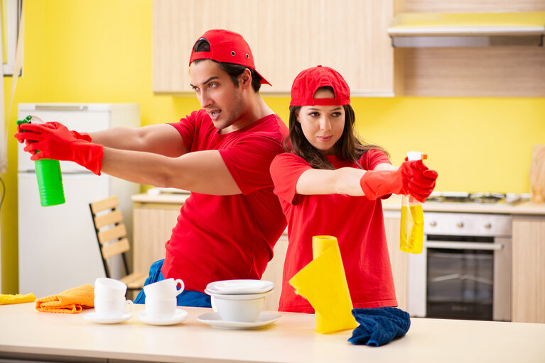 Cleaning professional contractors working at kitchen