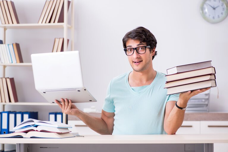 Young handsome student preparing for school exams