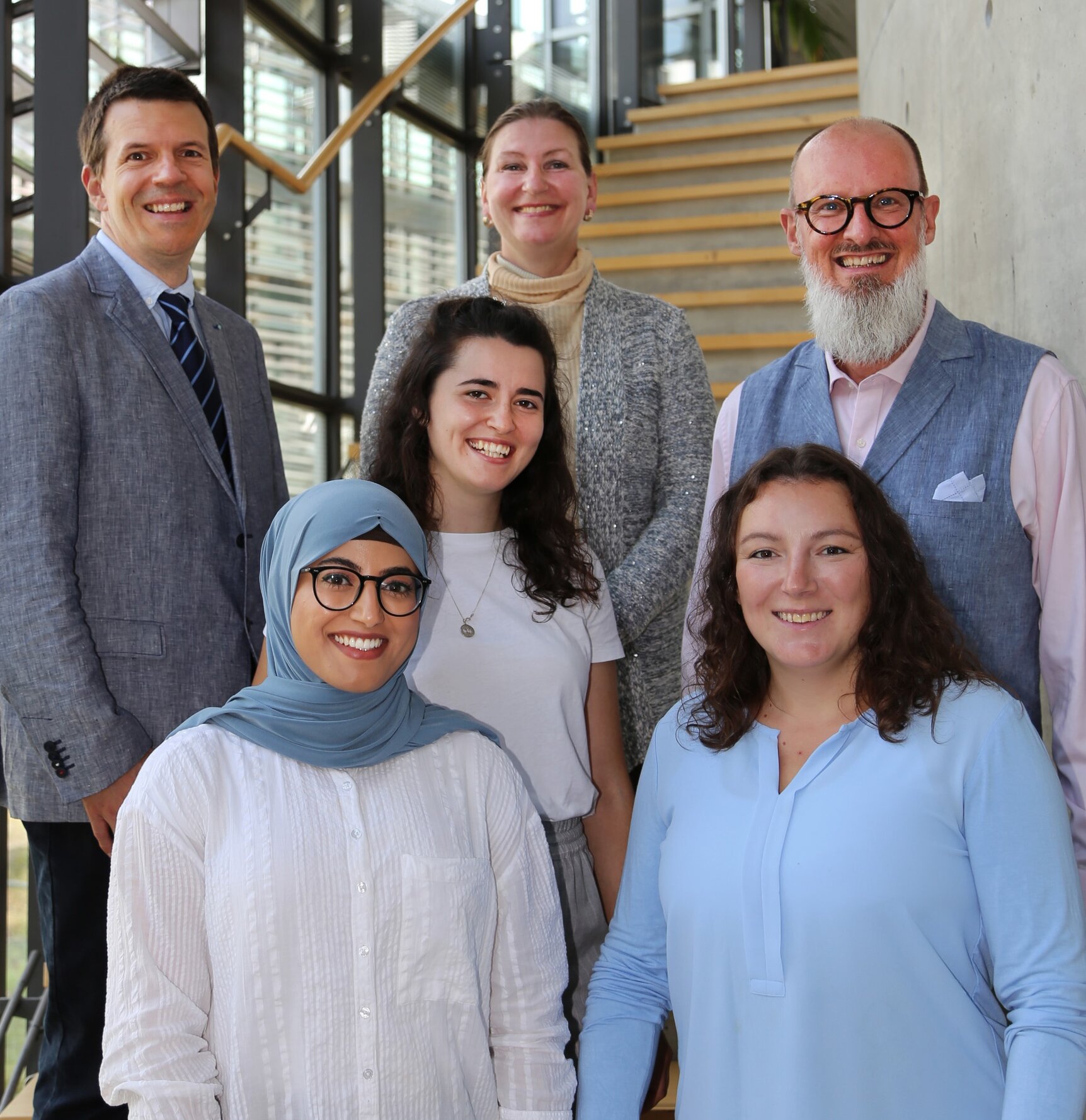 Meet the team - on the library staircase!