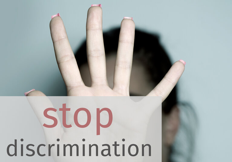 text stop discrimination and woman asking to stop