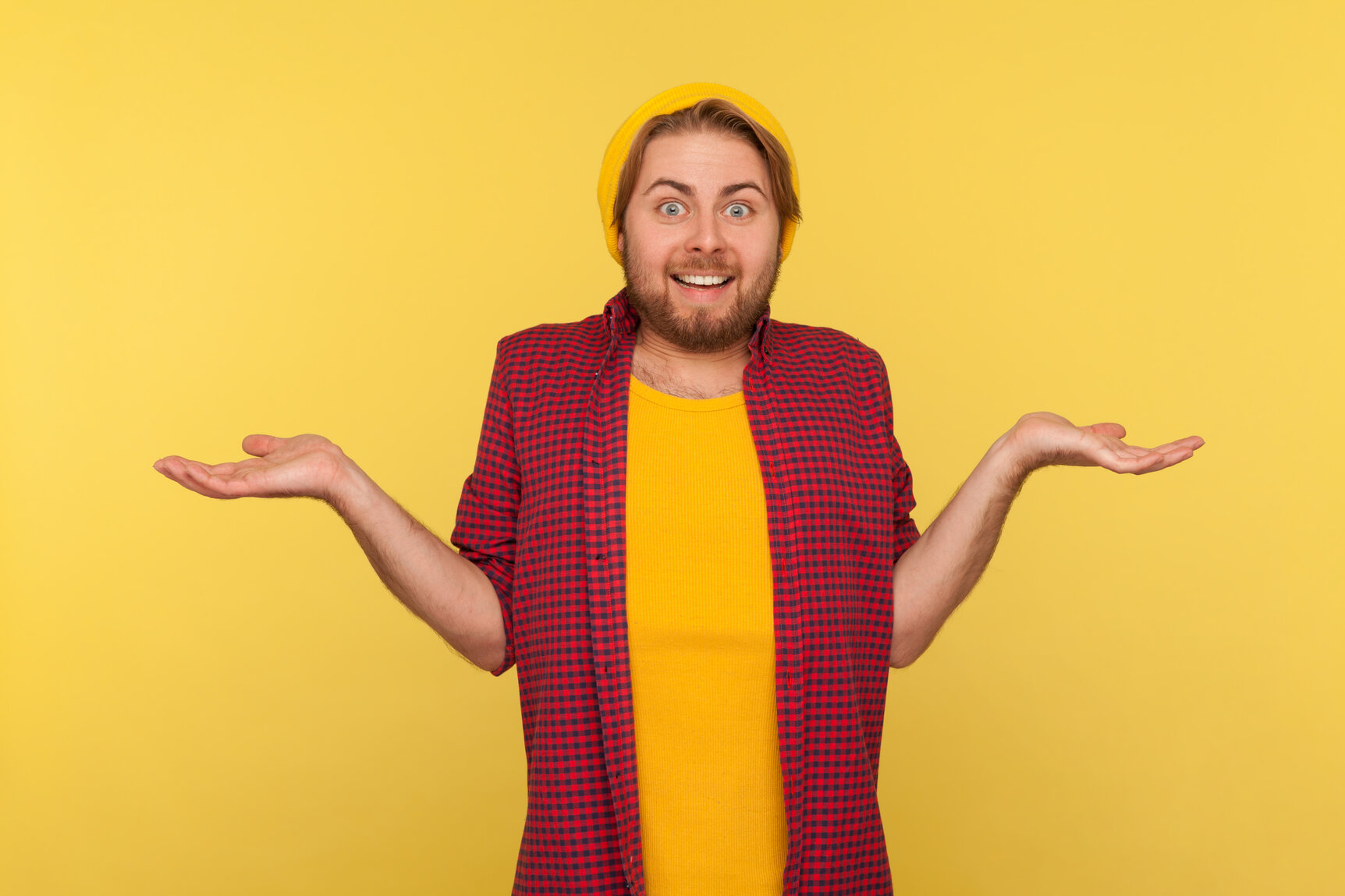 Don't know, who cares! Confused hipster bearded guy in beanie hat and checkered shirt standing with no idea gesture